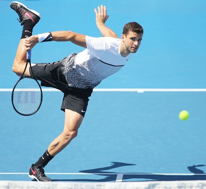 Grigor Dimitrov of Bulgaria serves in his first round match against Dustin Brown of Germany