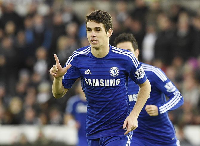 Chelsea's Oscar celebrates after scoring against Swansea City during their English Premier League match at the Liberty Stadium in Swansea, Wales on Saturday