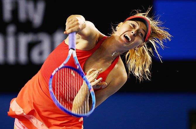  Maria Sharapova of Russia serves in her first round match against Petra Martic of Croatia 
