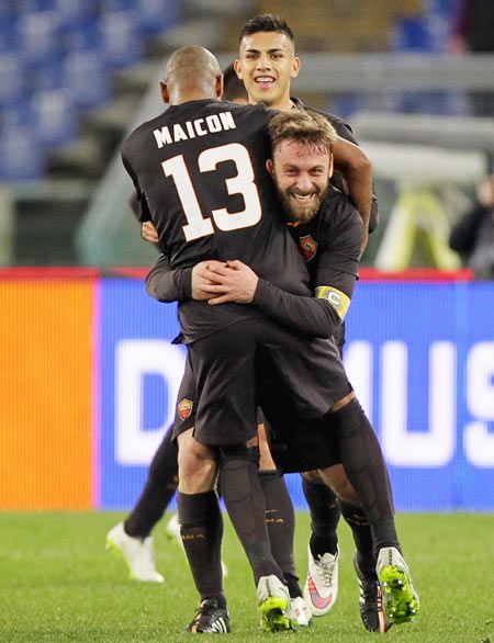 Daniele De Rossi of AS Roma celebrates with teammate Maicon after scoring their second goal from the penalty spot during their Italian Cup against Empoli FC at Olimpico Stadium in Rome on Tuesday 