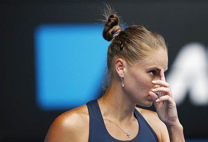 Alexandra Panova of Russia reacts after hitting a shot against compatriot Maria Sharapova