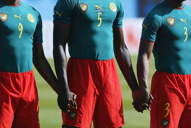 The Cameroon team line-up in their one peace kit before the African Nations Cup 2004 quafter-final match 