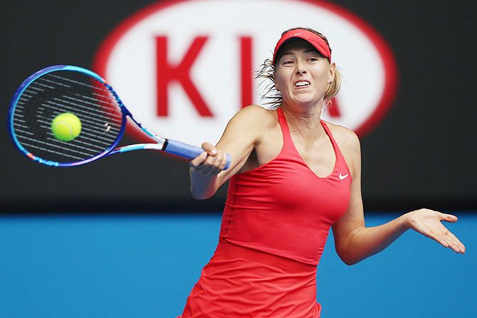 Maria Sharapova of Russia plays a forehand in her quarterfinal match against Eugenie Bouchard of Canada 
