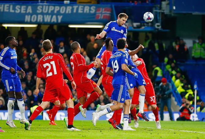 Branislav Ivanovic of Chelsea heads a goal in extra time during the League Cup Capital One semi-final second leg against Liverpool at Stamford Bridge in London on Tuesday