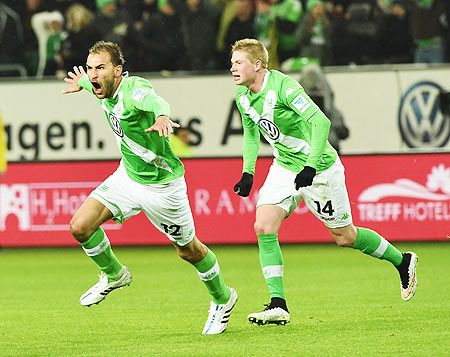 Bas Dost of Wolfsburg celebrates scoring his second goal against FC Bayern Muenchen during their Bundesliga match at Volkswagen Arena in Wolfsburg on Friday