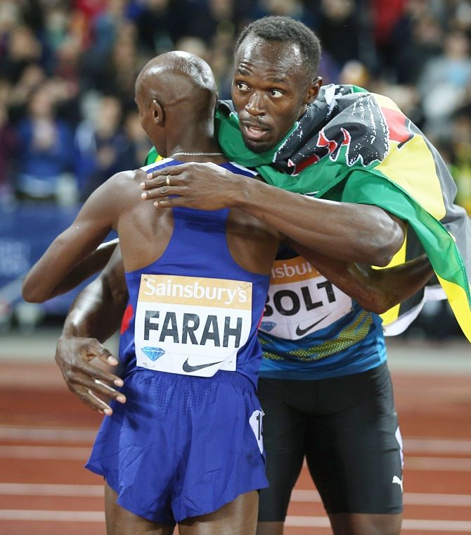 Usain Bolt of Jamaica, right, congratulates Mo Farah 