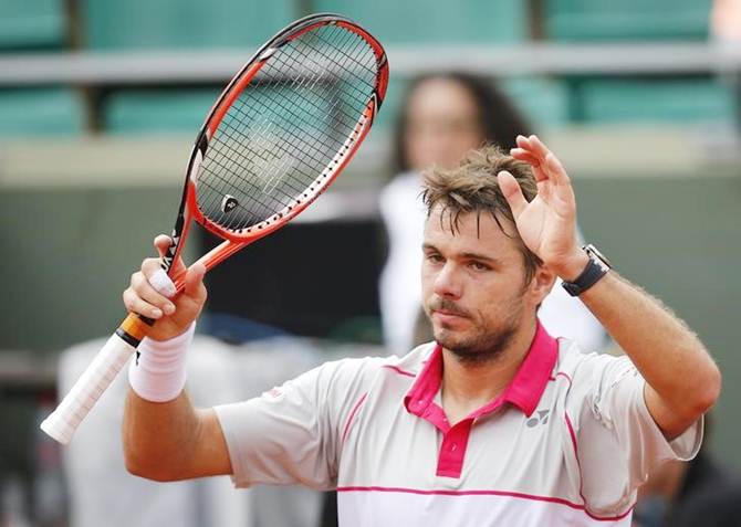 Switzerland’s Stanislas Wawrinka celebrates after defeating France’s Jo-Wilfried Tsonga in the semi-finals of the French Open