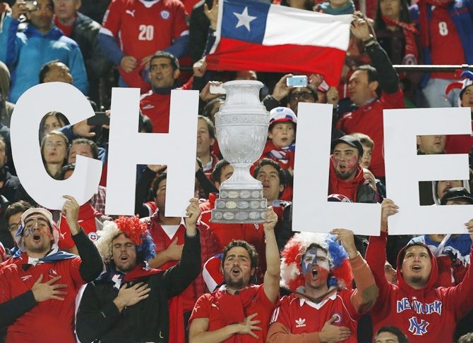 Chilean fans sing their country's national anthem