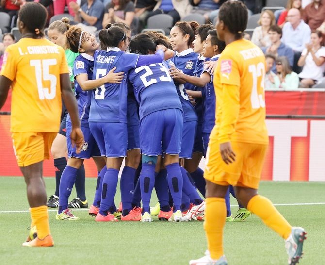  Thailand's players celebrate the first goal by Orathai Srimanee