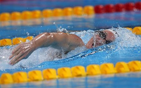 Camille Muffat of France competes in the women's 200m freestyle heats during the World Swimming Championships at the Sant Jordi arena 