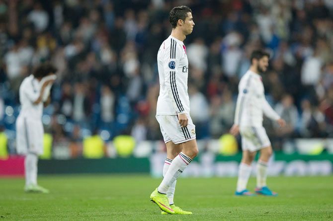 Cristiano Ronaldo of Real Madrid CF leaves the pitch after losing the UEFA Champions League round of 16 second leg match to FC Schalke 04 at Estadio Santiago Bernabeu on Tuesday