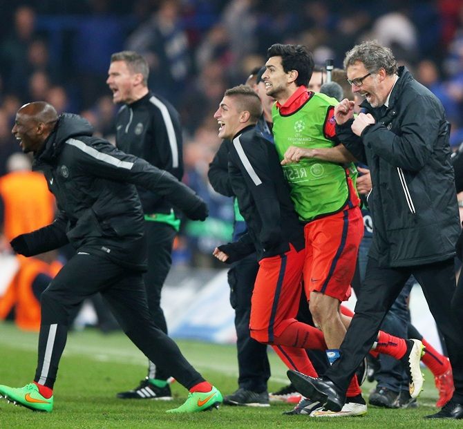 Laurent Blanc the head coach of PSG and his players celebrate