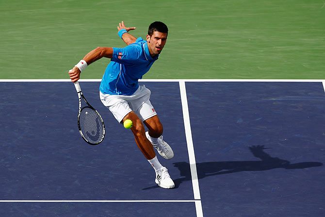 Novak Djokovic in action against Roger Federer