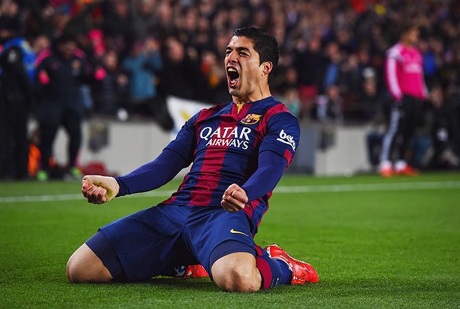 Barcelona's Luis Suarez celebrates as he scores the winner against Real Madrid CF during their La Liga match at Camp Nou on Sunday