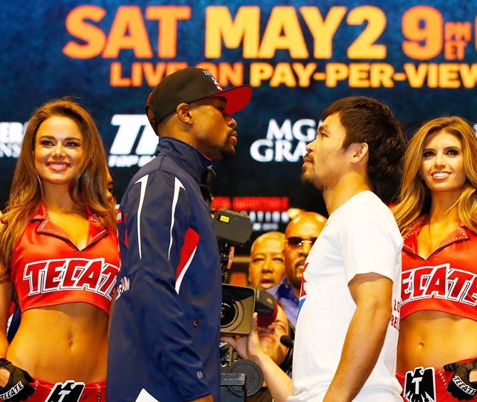 Floyd Mayweather Jr, left, and Manny Pacquiao face off 