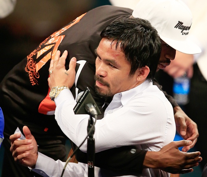 Floyd Mayweather hugs Manny Pacquiao