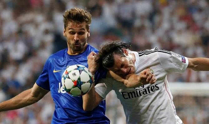 Juventus's Fernando Llorente checks Real Madrid's Gareth Bale