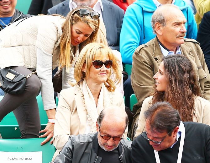 From left, Rafael Nadal's sister, mother Ana Maria Parera and girlfriend Xisca Perello