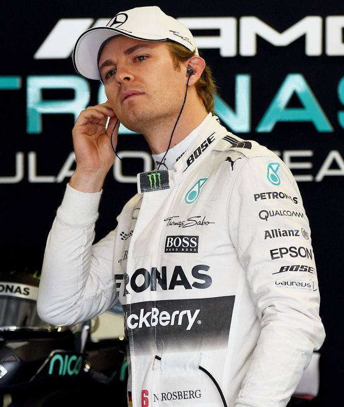 Germany and Mercedes GP's Nico Rosberg looks on in the garage