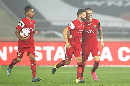 NorthEast United's Simao Sabrosa celebrates with teammates after scoring the equaliser against Delhi Dynamos on Tuesday