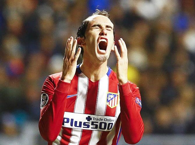 Atletico Madrid's Diego Godin reacts after a missed chance during the Champions League group C match against Astana in Astana, Kazakhstan, on Tuesday