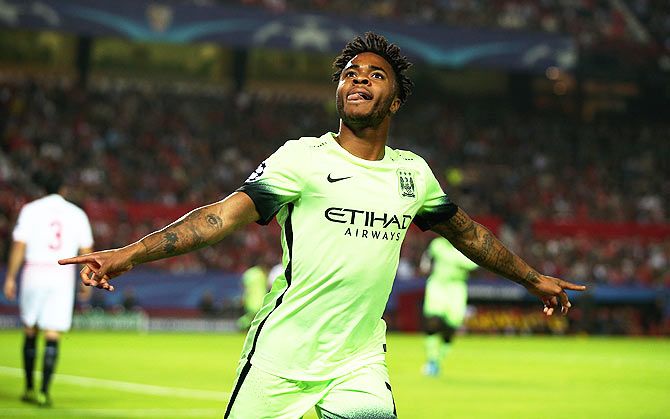 Manchester City's Raheem Sterling celebrates as he scores their first goal against Sevilla FC during the UEFA Champions League Group D match at Estadio Ramon Sanchez Pizjuan in Seville on Tuesday