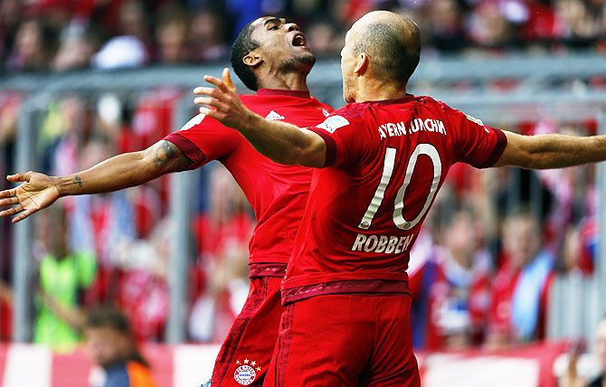 Bayern Munich's Arjen Robben (right) celebrates with Douglas Costa after scoring agains VfB Stuttgart during their Bundesliga match in Munich, on Saturday