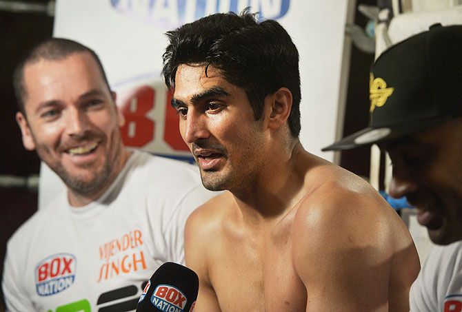 Vijender Singh (centre) is interviewed after his middleweight bout with Dean Gillen on The Second Coming boxing bill at the National Stadium in Dublin on Saturday