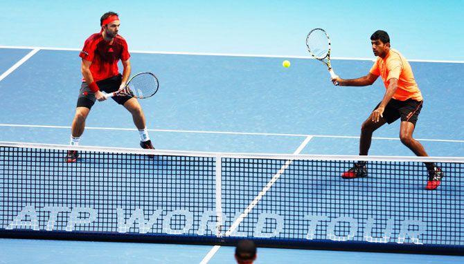 Romania's Florin Mergea (left) and India's Rohan Bopanna in action in their men's doubles match against USA's Bob Bryan and Mike Bryan