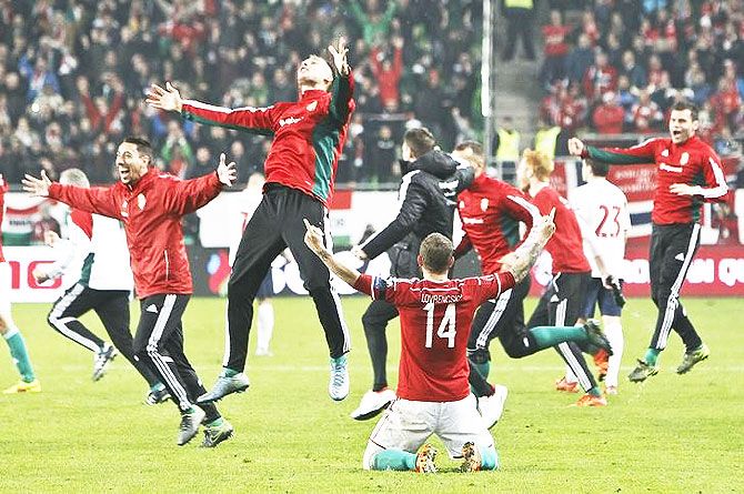 Hungary's players celebrate after winning the match against Norway and qualify for Euro 2016, at Grupama Arena in Budapest on Monday