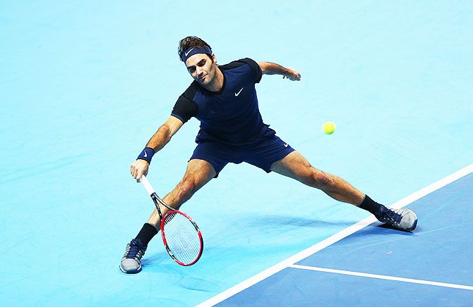 Switzerland's Roger Federer plays a forehand in his men's singles match against Czech Republic's Tomas Berdych