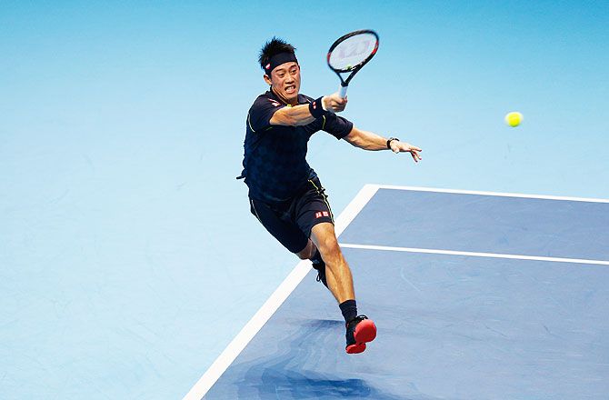 Japan's Kei Nishikori plays a forehand against Serbia's Novak Djokovic