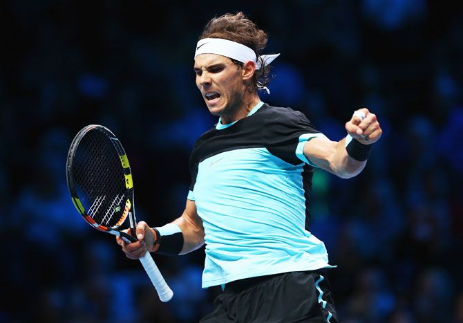 Spain's Rafael Nadal celebrates a point in his men's singles match against Switzerland's Stanislas Wawrinka on Day 2 of the Barclays ATP World Tour Finals at O2 Arena in London on Monday