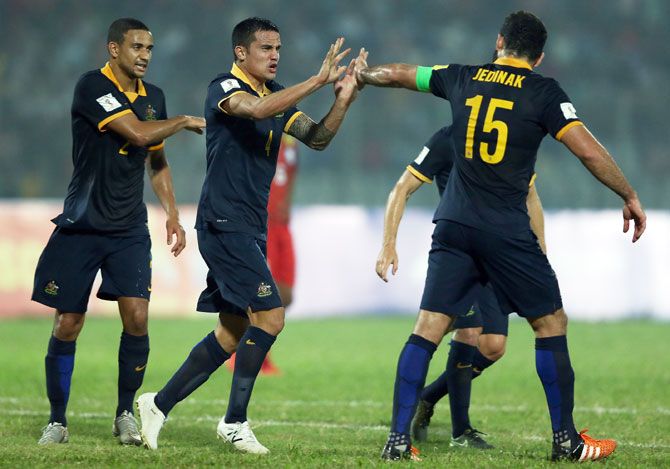 Australia Socceroos' Tim Cahill celebrates with teammate Mile Jedinak after scoring against Bangladesh during their 2018 FIFA World Cup qualification match at Bangabandhu National Stadium in Dhaka on Tuesday