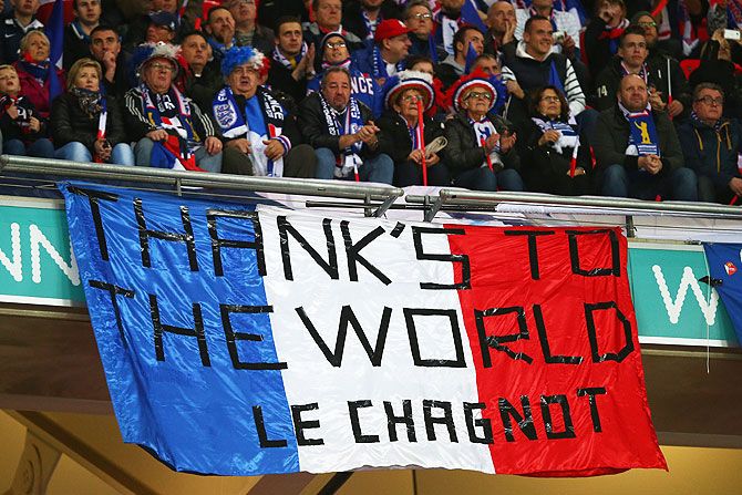 French supporters hold a banner appreciating the global support, following the terror attack in Paris