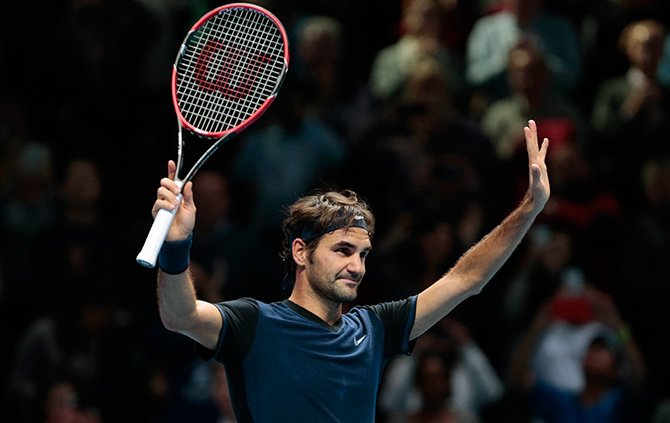 Switzerland's Roger Federer celebrates after winning his match against Japan's Kei Nishikori  