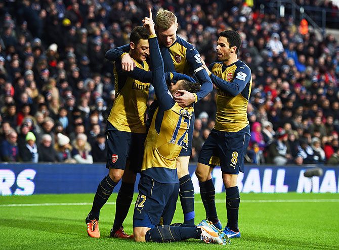 Arsenal's Olivier Giroud (centre) celebrates a goal with teammates