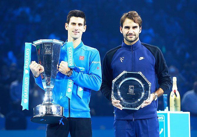 Winner Novak Djokovic and runner-up Roger Federer pose with their trophies