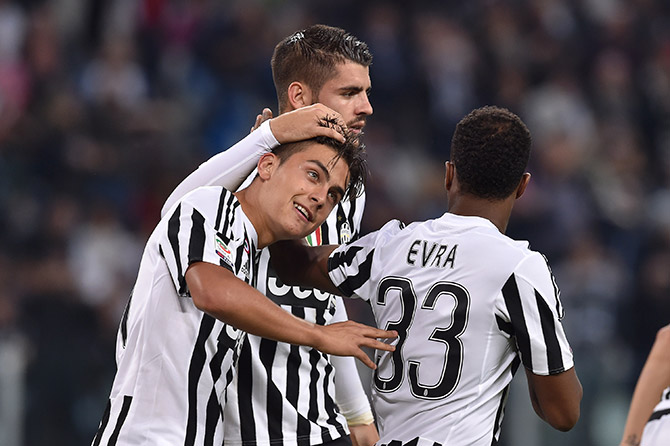 Paulo Dybala (left) of Juventus FC celebrates his goal with team mate Alvaro Morata 