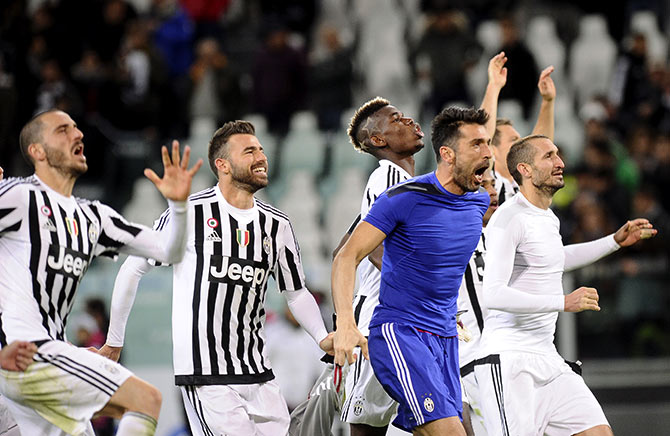 Juventus goalkeeper Gianluigi Buffon celebrates with his team mates 