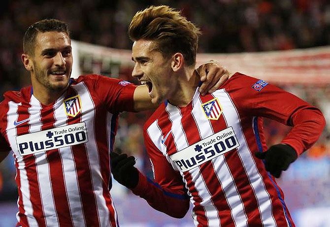 Atletico Madrid's Antoine Griezmann celebrates with teammate Jorge "Koke" Resurreccion after scoring against Galatasaray during their UEFA Champions League Group C match at Vicente Calderon stadium on Wednesday