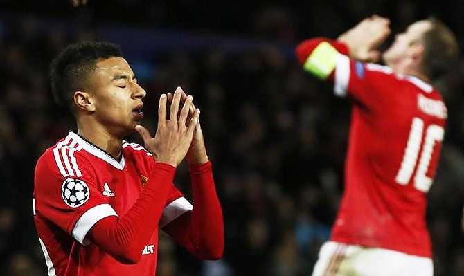 Manchester United's Jesse Lingard and Wayne Rooney look dejected after missing scoring opportunity during their UEFA Champions League Group B match against PSV Eindhoven at Old Trafford on Wednesday