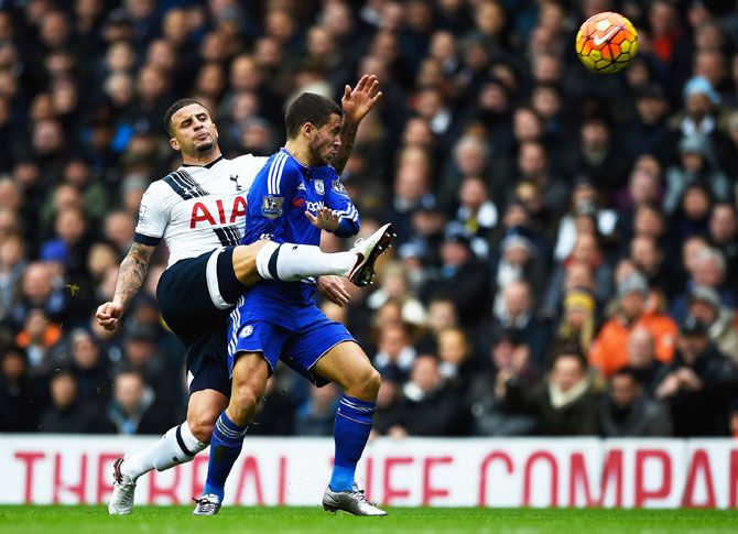 Tottenham Hotspur's Kyle Walker (left) clears the ball past Chelsea's Eden Hazard