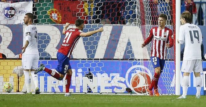 Atletico Madrid's Luciano Vietto (2nd from) celebrates after scoring against Real Madrid during their La Liga derby match at the Vicente Calderon stadium in Madrid, on Sunday