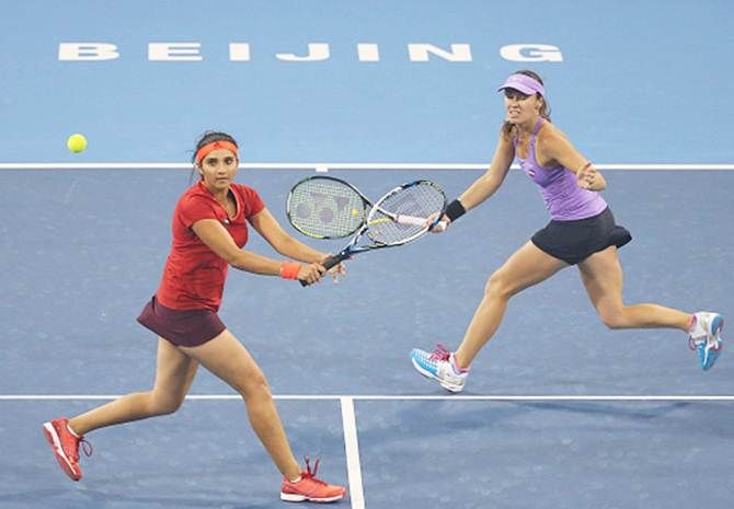 Sania Mirza, left, and Martina Hingis at the China Open