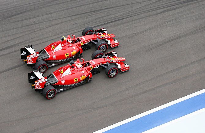 Ferrari's Kimi Raikkonen and Sebastian Vettel go head to head