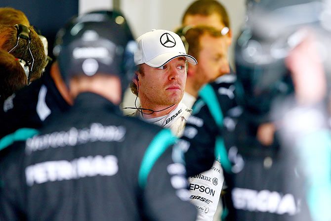 Mercedes GP's German driver Nico Rosberg looks on in the garage after retiring from the race