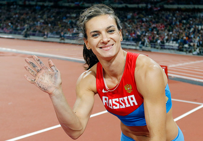 Russia's Yelena Isinbayeva waves to fans during the London Olympics 