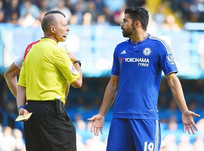 Chelsea's Diego Costais shown a yellow card by referee Mike Dean