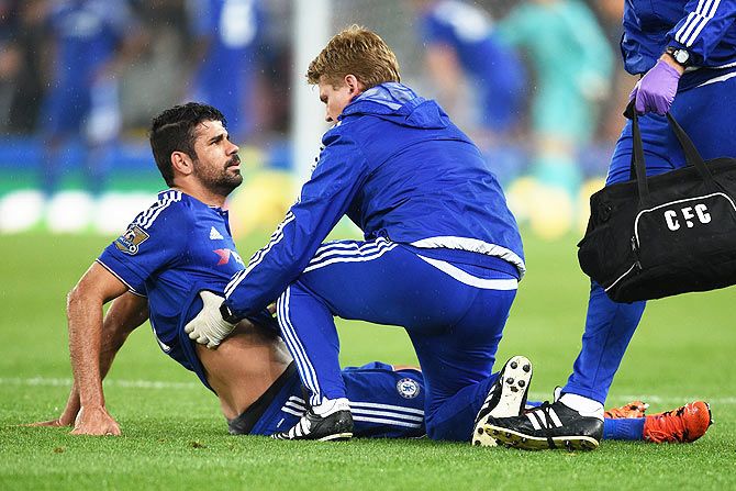 Chelsea's Diego Costa receives medical treatment prior to leaving the pitch due to injury during the Capital One League Cup fourth round match against Stoke City at the Britannia Stadium in Stoke on Trent on Tuesday